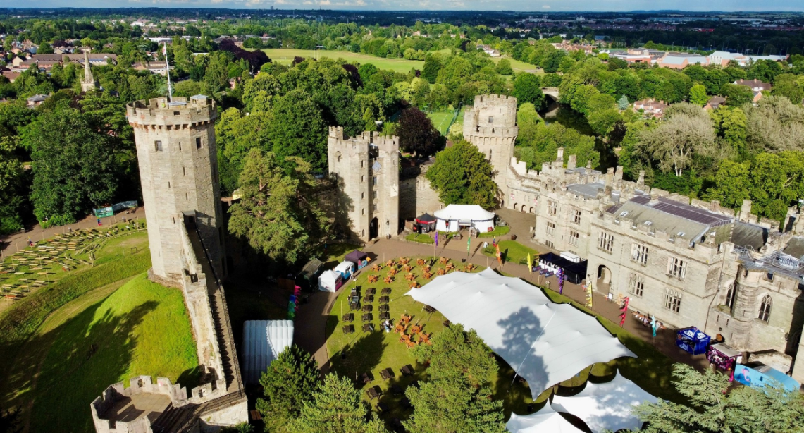 An aerial short of a stretch marquee set-up at Warwick Castle, we specialise in stretch marquee hire for festivals, corporate events, and summer parties.